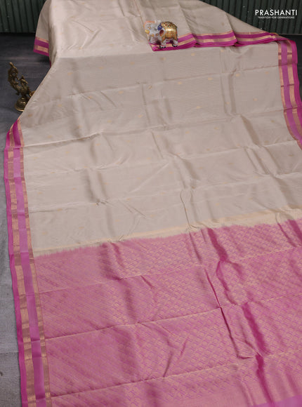 Kanchipuram silk saree beige and pink with allover zari weaves & buttas and rettapet zari woven border