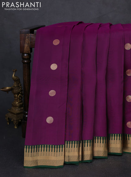 Kanchipuram silk saree purple and green with zari woven geometric buttas and temple design zari woven border