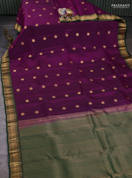 Kanchipuram silk saree purple and green with zari woven geometric buttas and temple design zari woven border