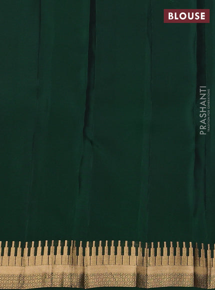 Kanchipuram silk saree purple and green with zari woven geometric buttas and temple design zari woven border