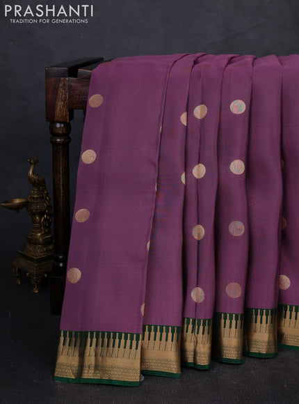 Kanchipuram silk saree pastel purple and green with zari woven geometric buttas and temple design zari woven border