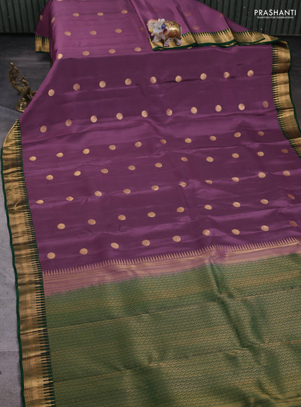 Kanchipuram silk saree pastel purple and green with zari woven geometric buttas and temple design zari woven border