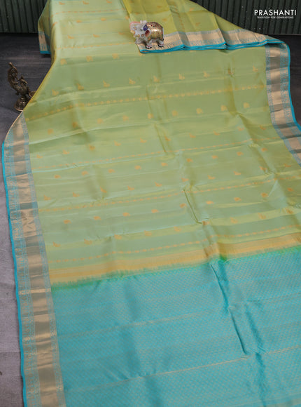 Kanchipuram silk saree dual tone pista green and teal blue with zari woven buttas and zari woven border