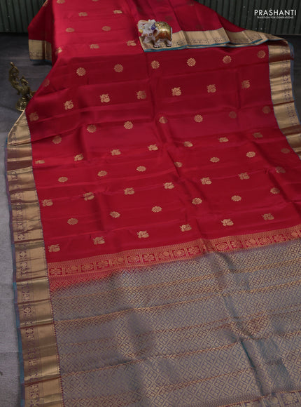 Kanchipuram silk saree tomato pink and dual tone teal green with zari woven buttas and zari woven border