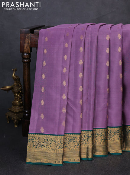 Kanchipuram silk saree pastel purple and teal green with allover zari woven buttas and zari woven border