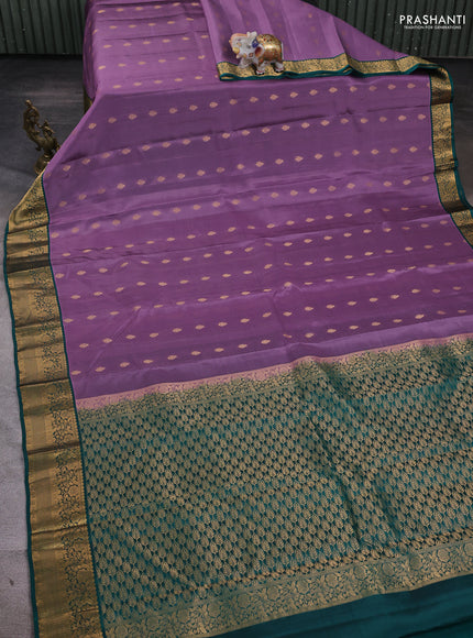 Kanchipuram silk saree pastel purple and teal green with allover zari woven buttas and zari woven border