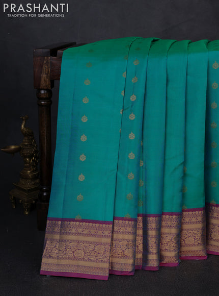 Kanchipuram silk saree teal green and pink with allover zari woven buttas and zari woven border