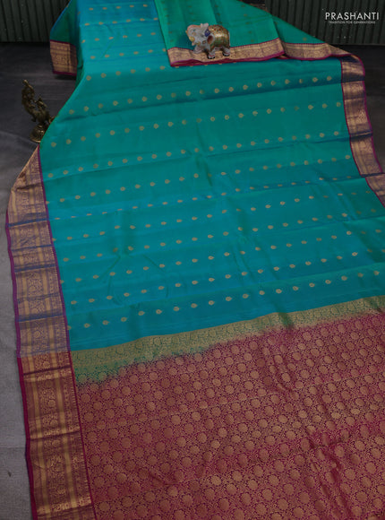 Kanchipuram silk saree teal green and pink with allover zari woven buttas and zari woven border