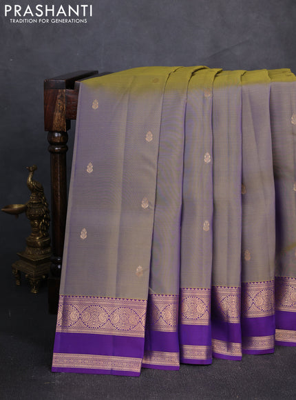 Kanchipuram silk saree meetalic green and purple with zari woven buttas and rettapet zari woven border
