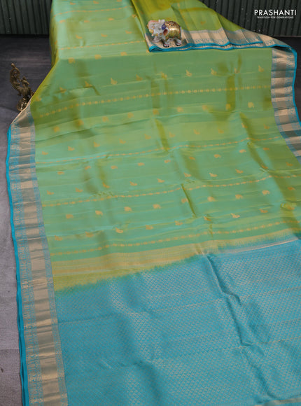 Kanchipuram silk saree dual tone light green and teal blue with zari woven buttas and zari woven border