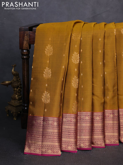 Kanchipuram silk saree dark mustard and dark magenta pink with allover zari woven buttas and rich zari woven border