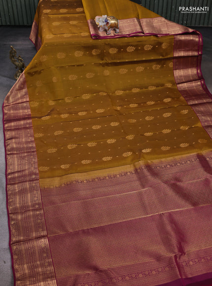 Kanchipuram silk saree dark mustard and dark magenta pink with allover zari woven buttas and rich zari woven border