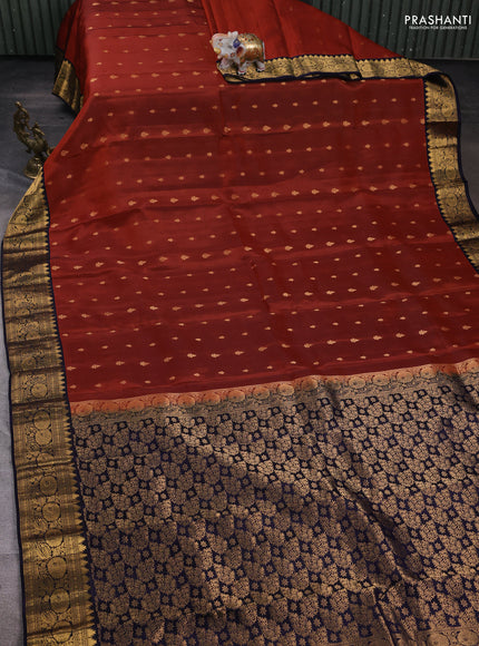 Kanchipuram silk saree rust shade and navy blue with allover zari woven buttas and rich zari woven border