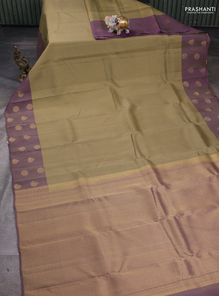 Kanchipuram silk saree elaichi green and dual tone purple with allover zari stripe pattern and zari woven butta border