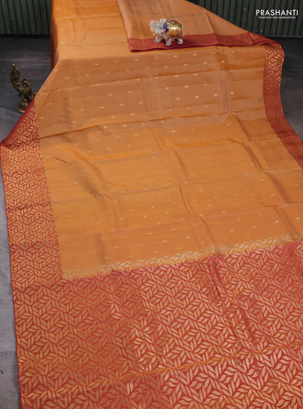 Kanchipuram silk saree sandal and dual tone rustic pink with zari woven buttas and zari woven border
