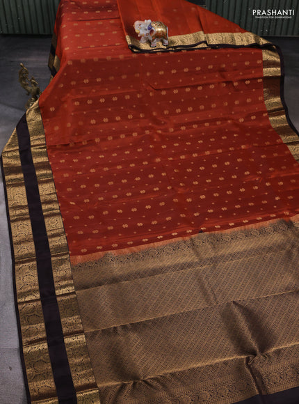 Kanchipuram silk saree rust shade and coffee brown with allover zari woven buttas and rettapet zari woven border