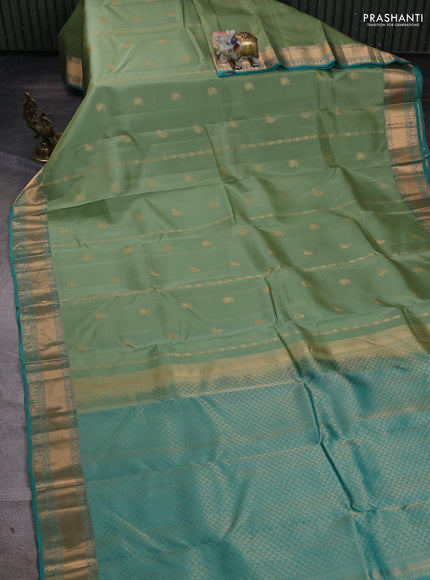 Kanchipuram silk saree pista green and teal green with zari woven buttas and zari woven border