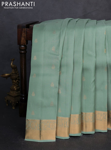 Kanchipuram silk saree pastel green and tomato pink with allover zari weaves & buttas and zari woven border