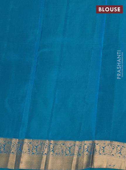 Kanchipuram silk saree dual tone pinkish orange and teal green with allover zari weaves & buttas and zari woven border