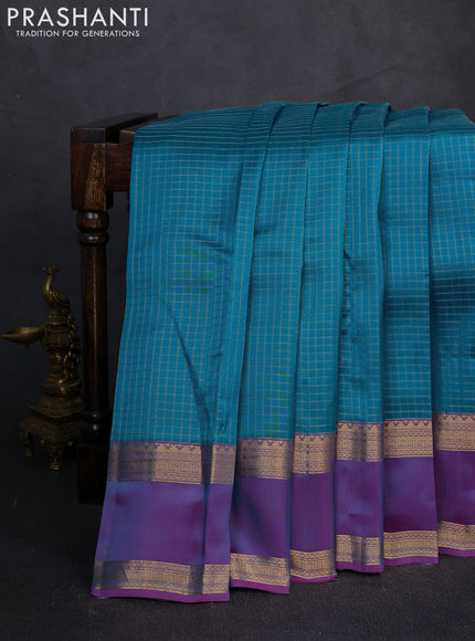Kanchipuram silk saree teal blue and dual tone purple with allover zari checked pattern and rettapet zari woven border