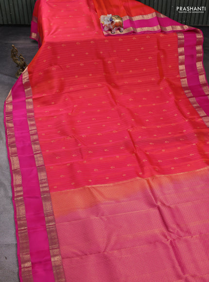 Kanchipuram silk saree dual tone pinkish orange and pink with allover zari weaves and rettapet zari woven border
