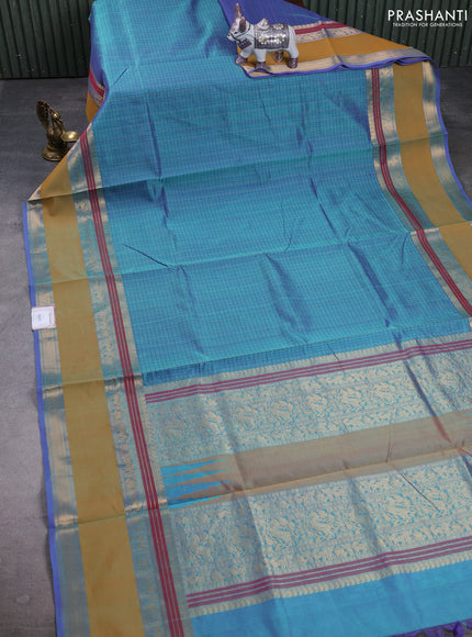 Kanchipuram silk cotton saree dual tone teal blue and mustard yellow with allover thread checks & buttas and rettapet zari woven border