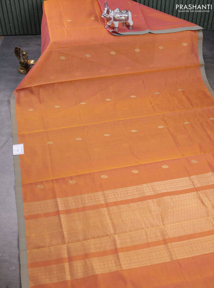 Kanchipuram silk cotton saree orange and beige with zari woven buttas and piping border