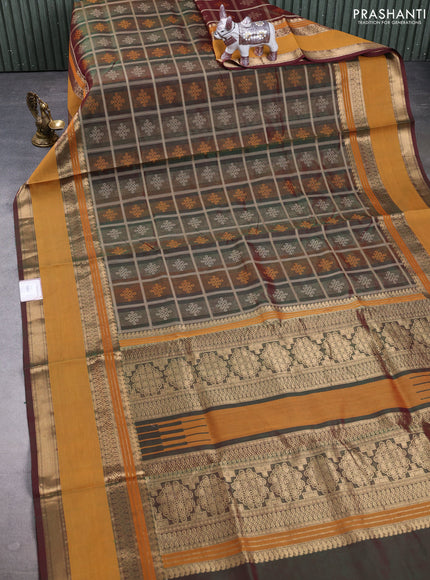 Kanchipuram silk cotton saree dual tone green and dark mustard with allover thread checks & rangoli buttas and rettapet zari woven border