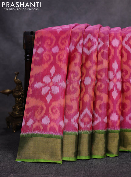 Ikat silk cotton saree pink and green with allover ikat weaves and zari woven border