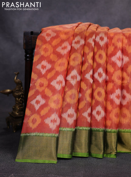 Ikat silk cotton saree orange and green with allover ikat weaves and zari woven border
