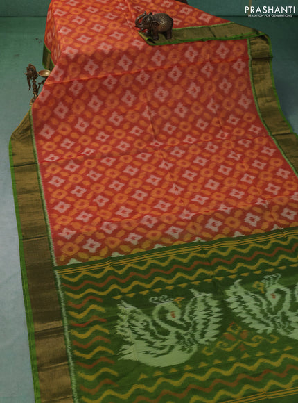 Ikat silk cotton saree orange and green with allover ikat weaves and zari woven border