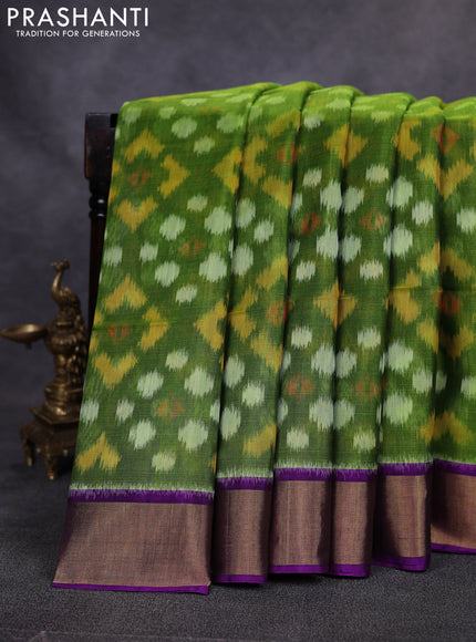 Ikat silk cotton saree green and purple with allover ikat weaves and zari woven border