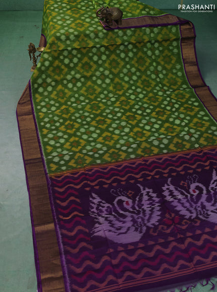 Ikat silk cotton saree green and purple with allover ikat weaves and zari woven border