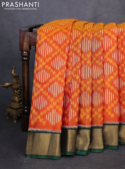 Ikat silk cotton saree orange and dark green with allover ikat weaves and zari woven border
