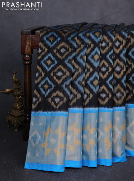 Ikat silk cotton saree black and cs blue with allover ikat weaves and long zari woven border