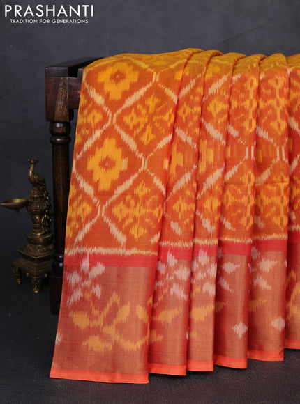 Ikat silk cotton saree orange with allover ikat weaves and long zari woven border
