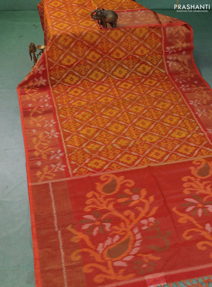 Ikat silk cotton saree orange with allover ikat weaves and long zari woven border