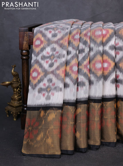 Ikat silk cotton saree grey and black with allover ikat weaves and long zari woven border