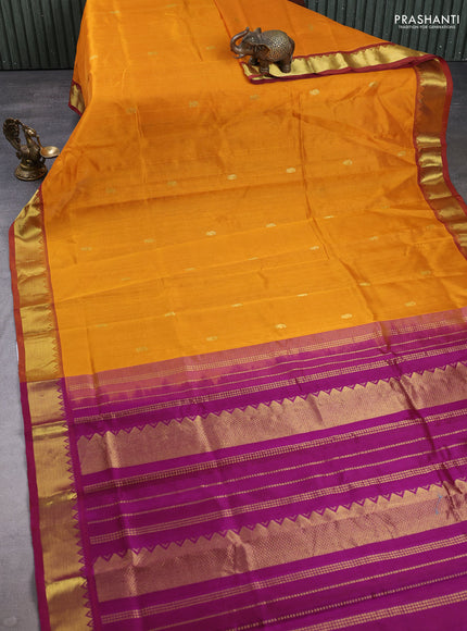 Silk cotton saree mustard yellow and purple with zari woven buttas and zari woven border
