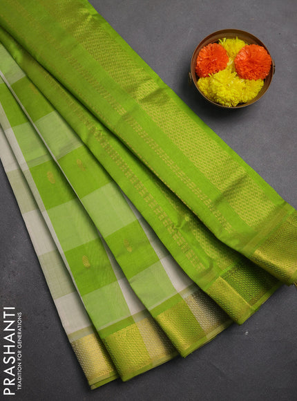 Silk cotton saree cream and light green with allover paalum pazhamum checks & buttas and zari woven border