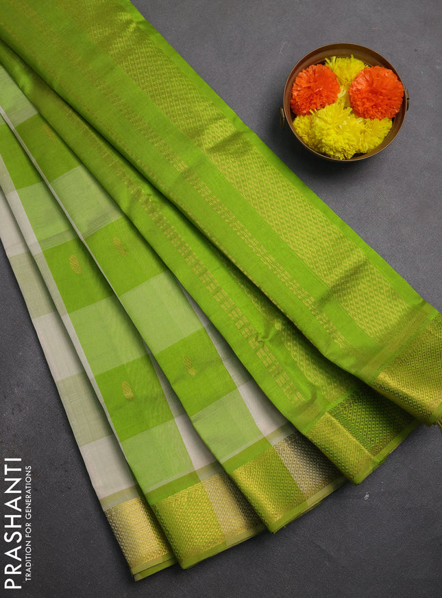 Silk cotton saree cream and light green with allover paalum pazhamum checks & buttas and zari woven border