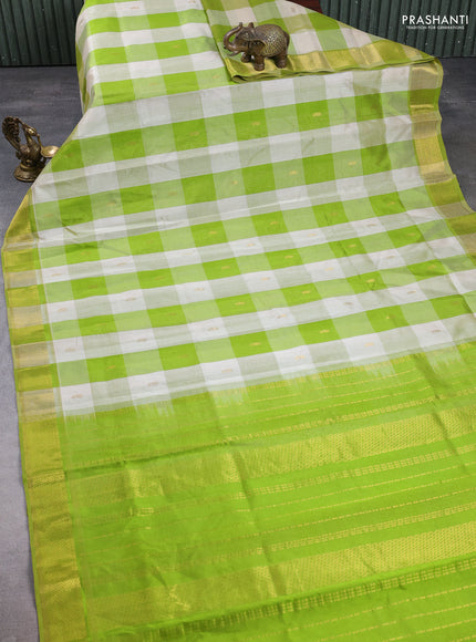 Silk cotton saree cream and light green with allover paalum pazhamum checks & buttas and zari woven border