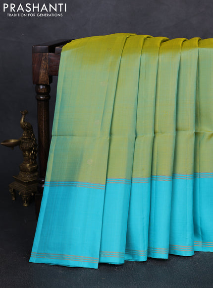 Pure soft silk saree dual shade of green and teal blue with allover zari woven buttas and rettapet zari woven border