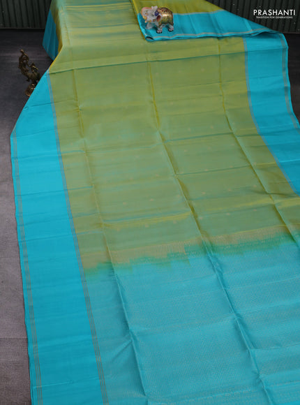 Pure soft silk saree dual shade of green and teal blue with allover zari woven buttas and rettapet zari woven border