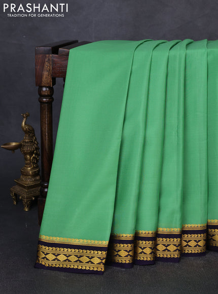 Pure mysore silk saree teal green shade and navy blue with plain body and zari woven border