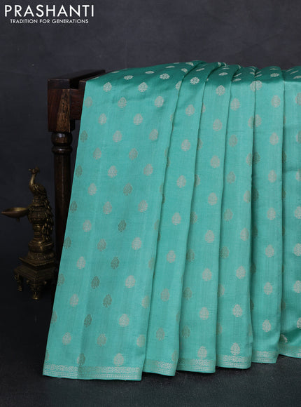 Chiniya silk saree teal green with allover zari woven buttas and zari woven border