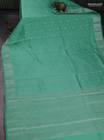 Chiniya silk saree teal shade with allover zari woven buttas and zari woven border