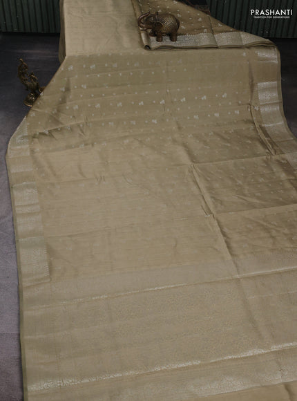 Chiniya silk saree elaichi green with allover zari woven buttas and zari woven border