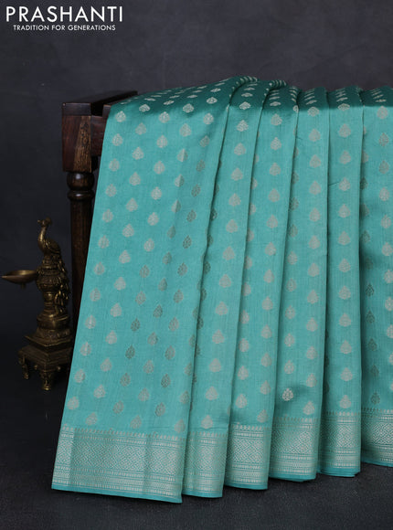Chiniya silk saree teal blue shade with allover zari woven buttas and zari woven border