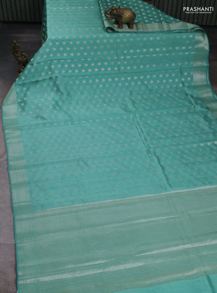 Chiniya silk saree teal blue shade with allover zari woven buttas and zari woven border